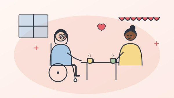 Woman with MS in her wheelchair enjoying coffee with a friend at a café